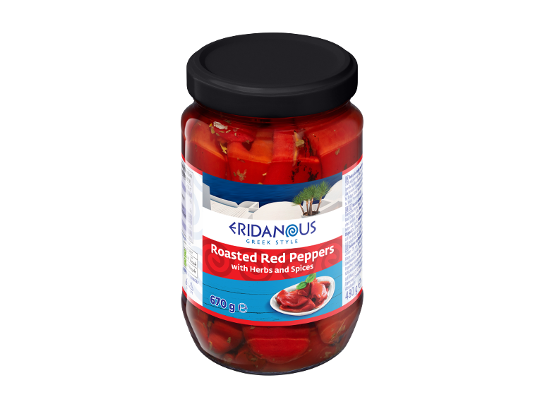 Greek style roasted red peppers with herbs and spices in a glass jar.