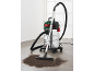 Wet and dry vacuum cleaner with a stainless steel tank and floor nozzle on a dirty floor.
