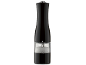 Black electric salt mill with a transparent chamber filled with coarse salt.