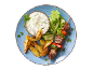 Meat and vegetable skewer, roasted potatoes, and tzatziki on a blue plate.