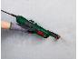 Multifunction tool cutting a copper pipe in a wall.