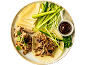 Peking duck style pulled duck with pancakes, cucumber, spring onion, and hoisin sauce.