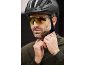 Man in a cycling helmet and sports sunglasses adjusting his jacket.