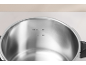 Interior of a stainless steel pressure cooker with max. 2/3 and 1/2 markings.