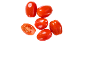 Fresh cherry tomatoes, some whole, one cut in half, on a black background.