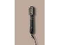 Black hot air styler brush for hair on a beige background