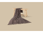 Dark brown knitted blanket with fringes draped over a light wooden bench.