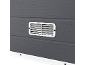 Close-up of a gray panel with a white ventilation grille.