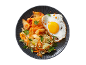 Fried rice with kimchi and a fried egg on a dark plate.