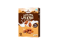 Box of salted caramel pillows cereal with milk splash and caramel pieces.