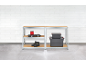 Metal shelving units with wooden boards, holding tools, shoes, and storage boxes.