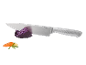 Kitchen knife with red cabbage, carrot, and rosemary on a black background.