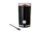 Black coffee grinder with ground coffee and a cleaning brush.