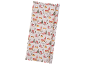 Christmas wrapping paper with a snowy village scene and 'Merry Christmas' text.
