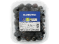 A clear plastic container of fresh blueberries with a blue label detailing product information.