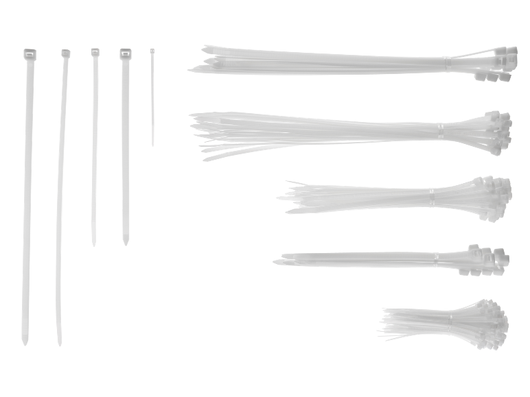 Various sizes and bundles of white cable ties on a black background.