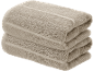 Stack of two folded beige towels.