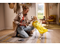 Woman with dog in yellow raincoat and treat bag, ready for a walk.