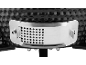 Metal air regulator on a black ceramic grill.