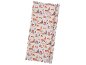 Christmas wrapping paper with a snowy village scene and 'Merry Christmas' text.