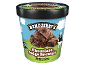 Chocolate ice cream with chocolate fudge brownie pieces, in a blue and green tub.