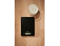 Kitchen scale and bowl of flour on a wooden surface.