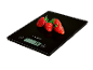 Strawberries on a black kitchen scale displaying 74 grams.