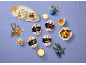 Festive arrangement with mini ice cream desserts in various flavors, coffee, and fruit.