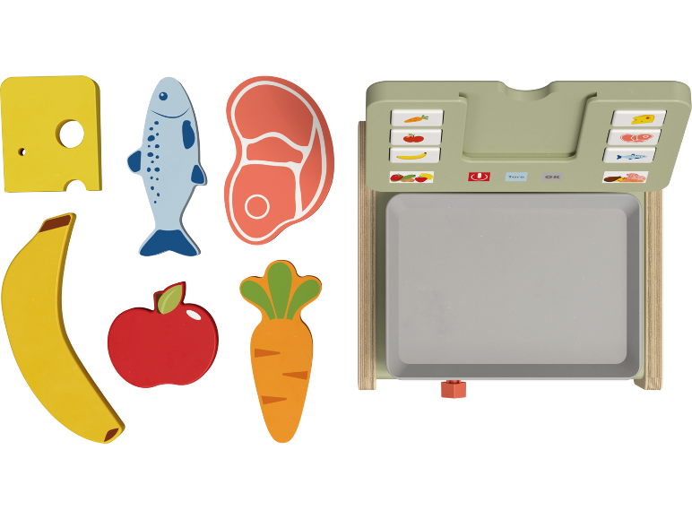 Wooden toy food items including cheese, fish, steak, banana, apple, carrot, and a toy scale.
