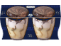 Two tiramisu gelato desserts with cocoa on a dark blue background with patterns.