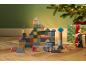 Wooden sea-themed building block set with animal figures and gifts under the tree.