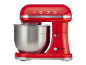 Red stand mixer with a stainless steel bowl and the number 1973 on top.
