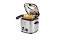 Silver deep fryer with crispy french fries in the basket, ready to serve.