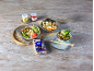 Japanese style sushi rice, ramen, and noodle soup, with ginger jars on a wooden table.