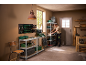 Man organizing tools and storage bins on shelves in a workshop.