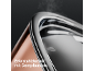 Stainless steel lid with steam outlet on a kitchen appliance.