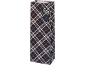 Gift bag with a dark plaid pattern and green handles.