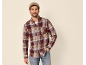 Man in a knit beanie, plaid shirt, and jeans.