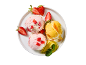 Strawberry and mango ice cream with fresh strawberries, mango, and mint on a white plate.