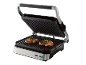 Open electric grill with two grilled beef steaks, with red and green indicator lights.