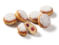 Doughnuts with powdered sugar and cherry jam filling, one cut in half.