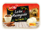 Leche Merengada ice cream with cinnamon and an old street scene.