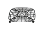 Air fryer crisper plate with a perforated design and rubber feet.