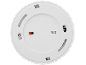 Underside of a white smoke detector with a red test button and inscriptions.