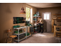 Man organizing tools and storage bins on shelves in a workshop.