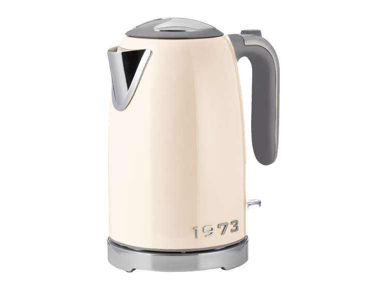 Beige electric kettle with chrome accents and the text '1973'.