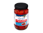 Greek style roasted red peppers with herbs and spices in a glass jar.