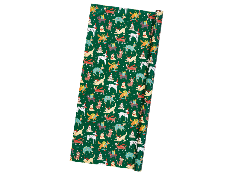 Green wrapping paper with Christmas dogs and festive motifs.