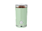 Light green coffee grinder with a transparent lid, filled with coffee beans.