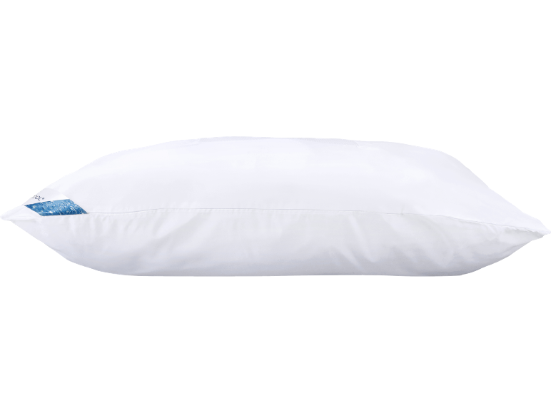 White pillow with a blue label featuring a bubble pattern and partially visible text.